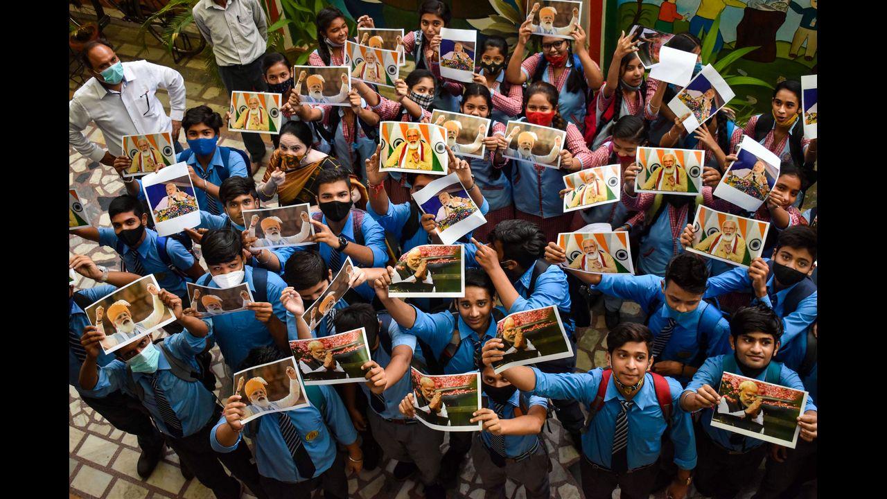 Children celebrate Prime Minister Narendra Modi's birthday at a school in Meerut. Pic/PTI
